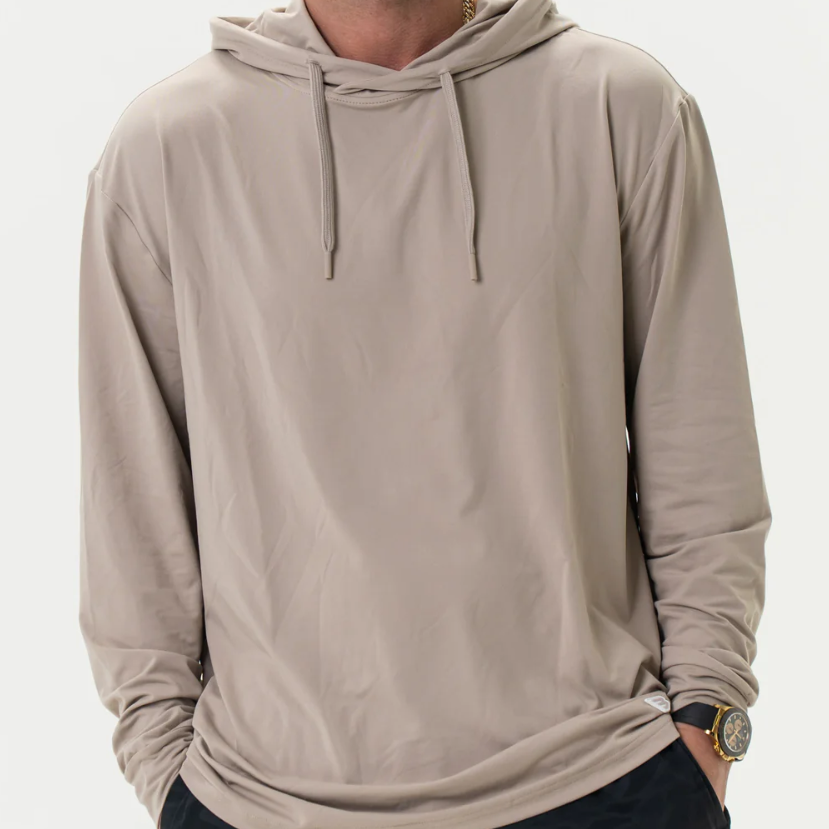 Man wearing a beige hoodie on a white background