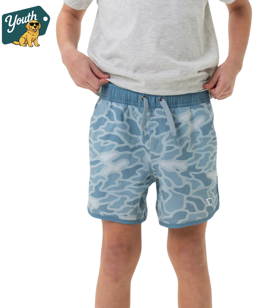Boy wearing blue camouflage shorts on a transparent background