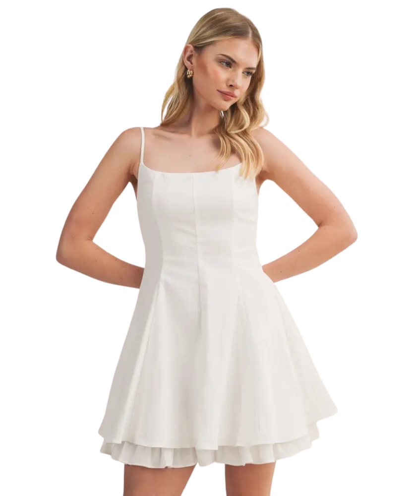 Woman wearing a white dress on a white background