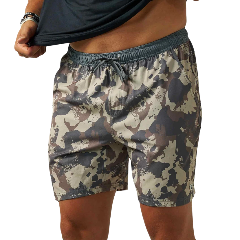 A person wearing camouflage athletic shorts and lifting a black shirt, shown from the chest to the upper thighs against a plain white background.