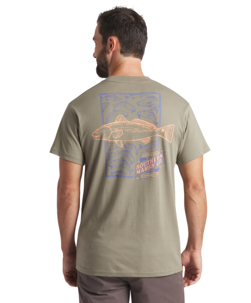 Man wearing a green t-shirt with a fish graphic on the back, standing against a white background