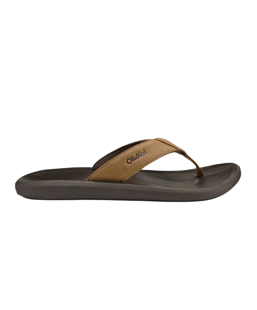 Brown sandal with a Olukai brand logo on a white background