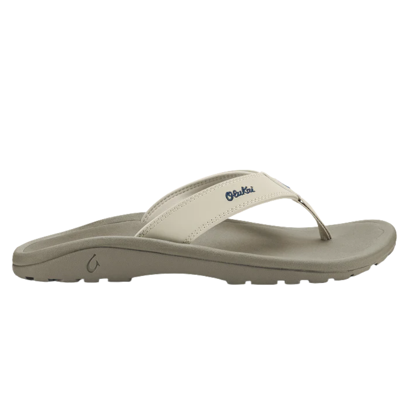 Beige sandal with a white strap on a white background