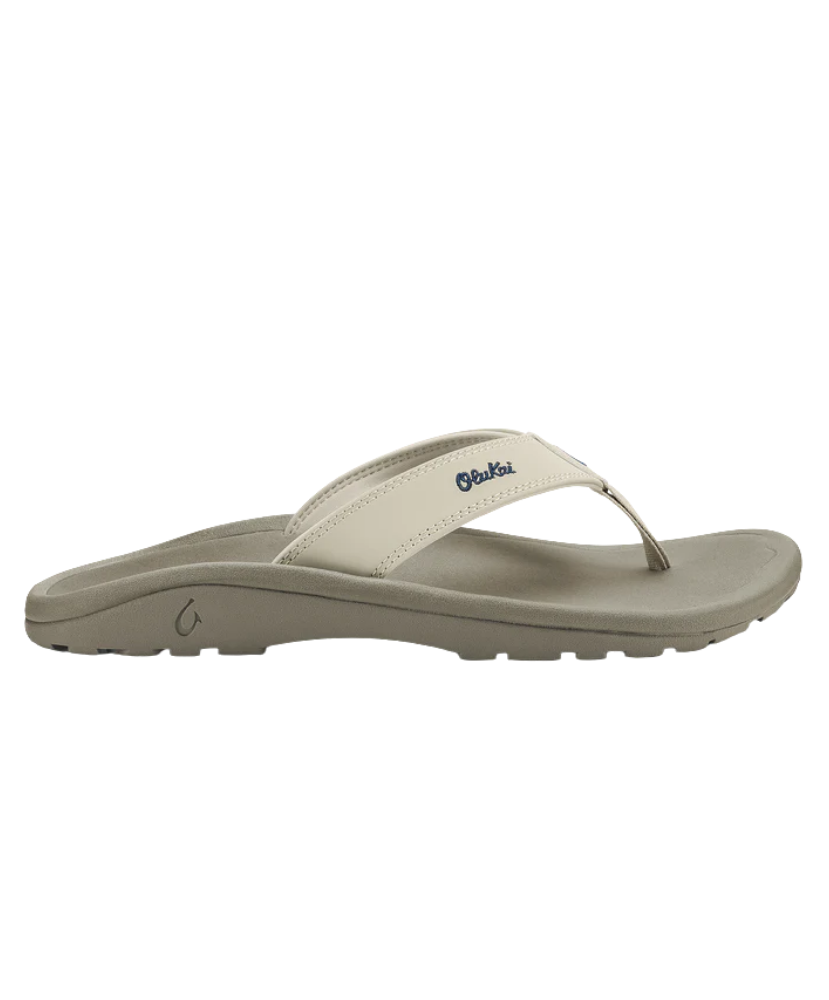 Beige sandal with a white strap on a white background