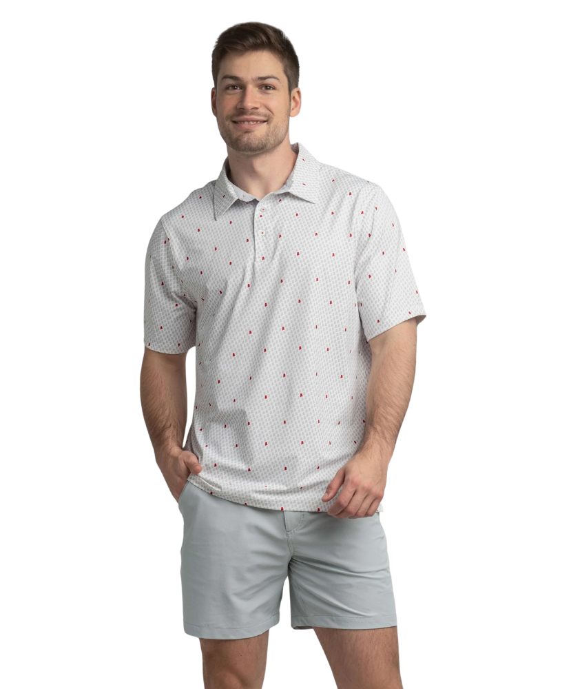 Man wearing a white polo shirt with red Alabama state outline pattern and 'SSCO' logo on a white background and light shorts on a white background