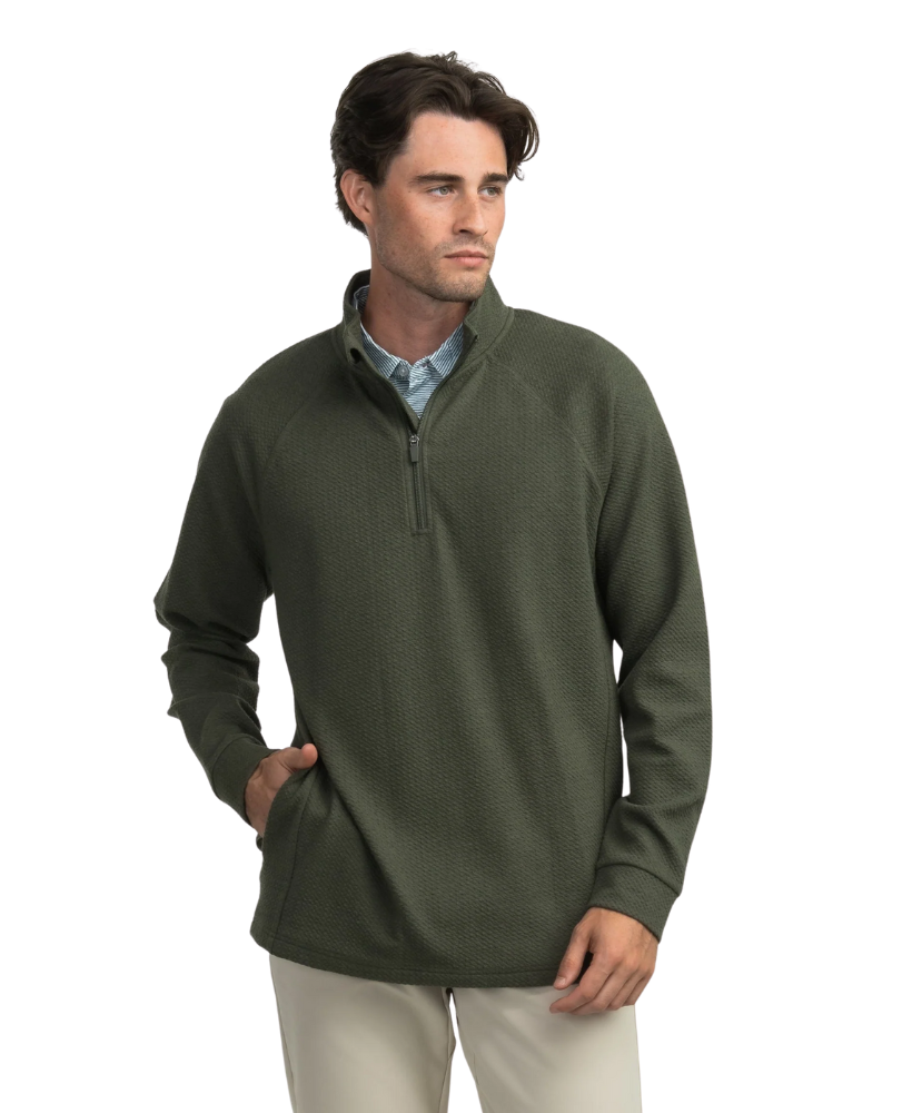 Man wearing a green pullover with a quarter zip on a white background