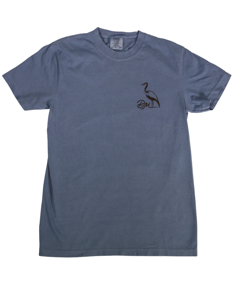 Blue t-shirt with a small DIRTY MARSH logo on the chest against a white background