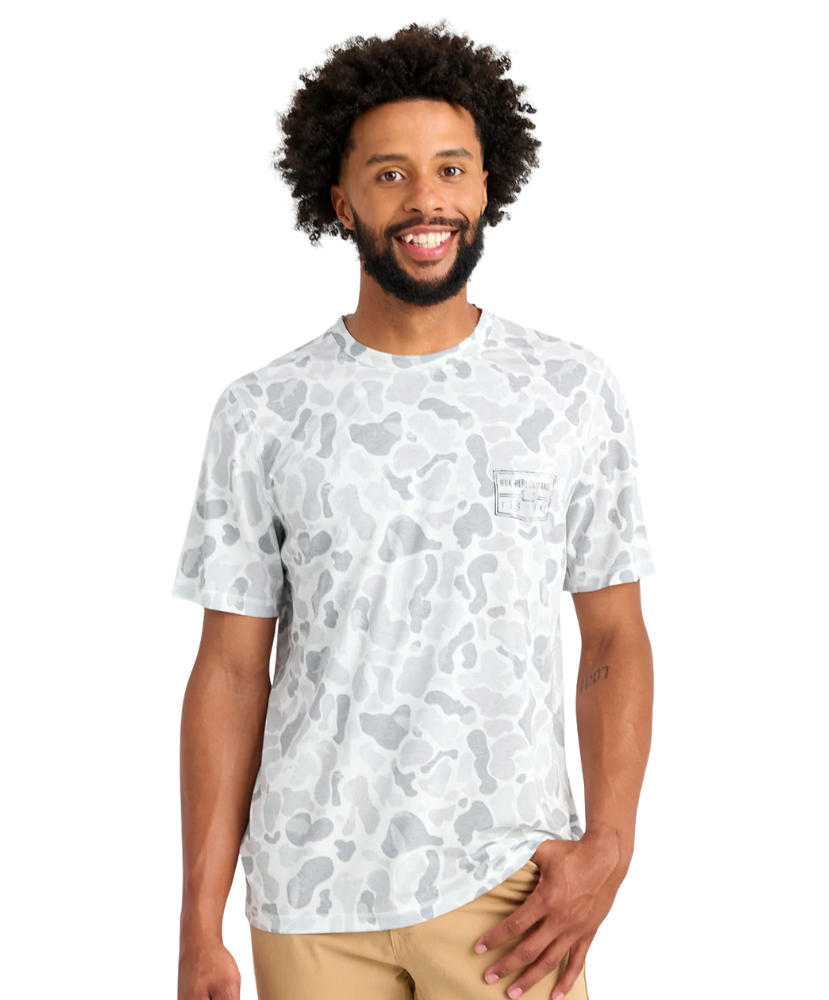 Man wearing a white t-shirt with a pattern on a white background