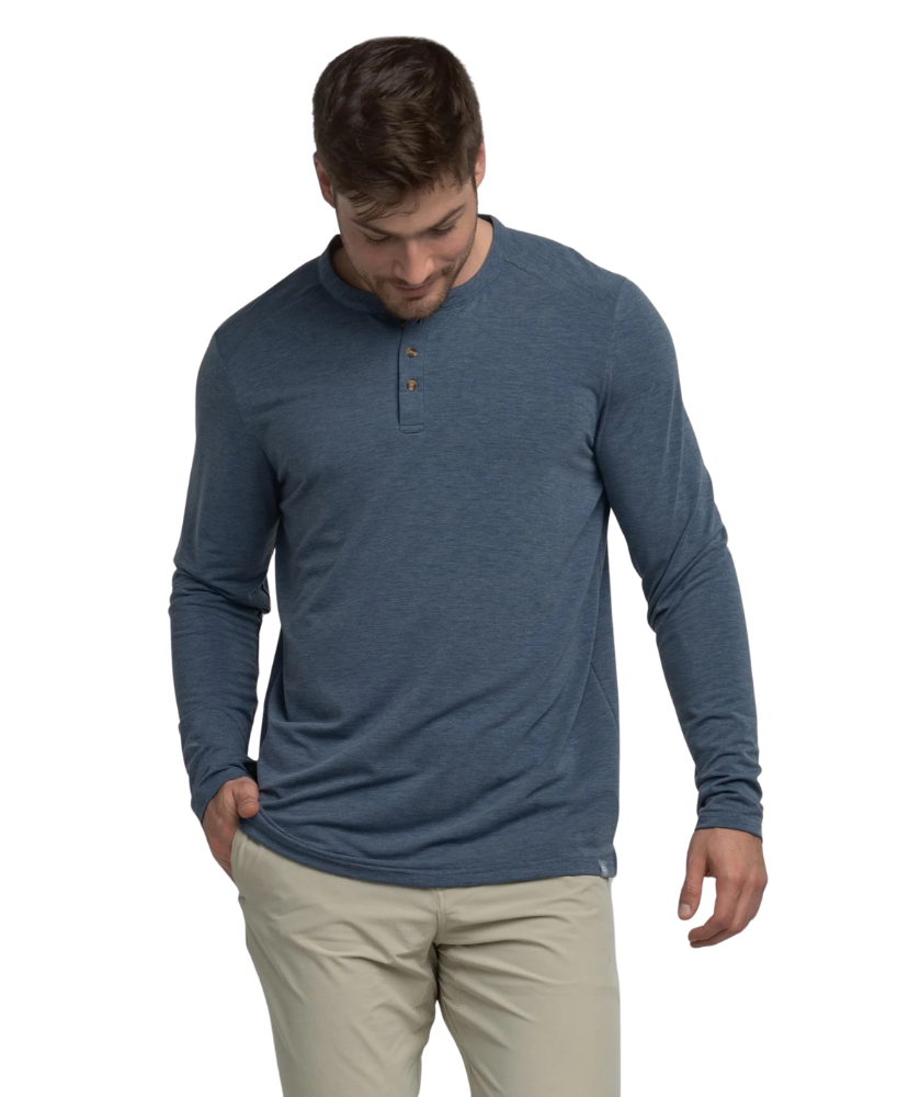 Man wearing a blue long-sleeve henley shirt on a white background