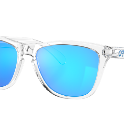 Oakley sunglasses with a clear transparent frame and vibrant blue mirrored lenses, shown on a solid white background.