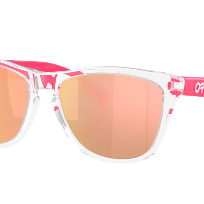 Oakley Frogskin Wayfarer-style sunglasses with a clear transparent frame, bright pink arms and bridge, and mirrored rose-gold lenses, shown on a plain white background.