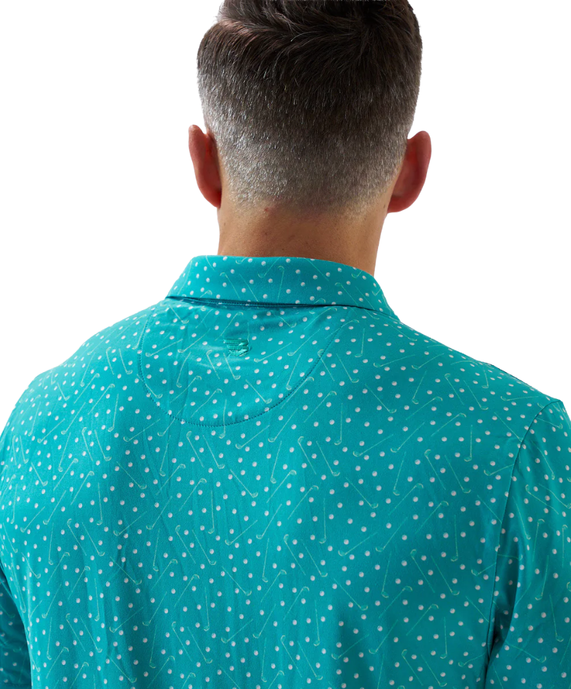 Man wearing a teal golf club and golf ball dot polo shirt on a white background