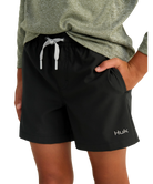 Black shorts with a visible brand logo worn by a person on a white background