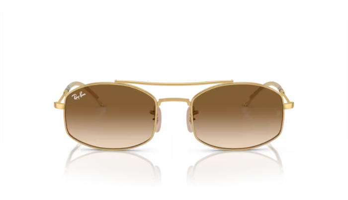 Gold-framed sunglasses with brown gradient lenses on a white background