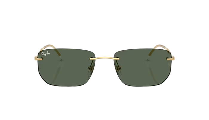 Sunglasses with gold frame and green lenses on a white background