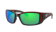 Sunglasses with green lenses and tortoiseshell frame on a white background