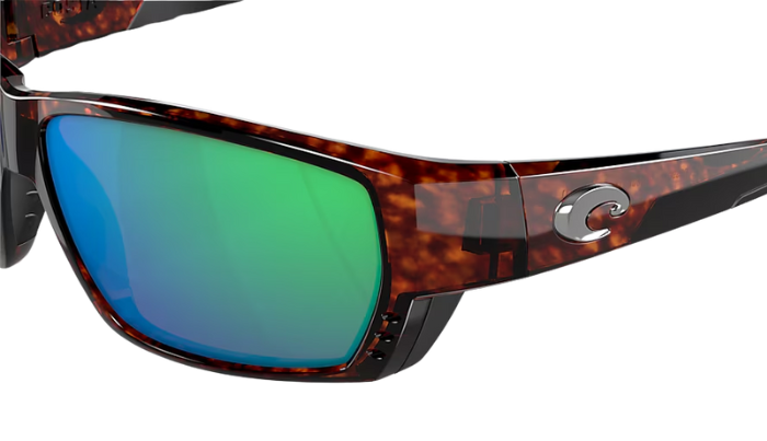 Costa Sunglasses with tortoiseshell frame and green mirror lenses on a white background