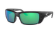 Black Costa wraparound sunglasses with green lenses on a white background