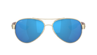 Gold-framed aviator Costa sunglasses with blue lenses on a white background