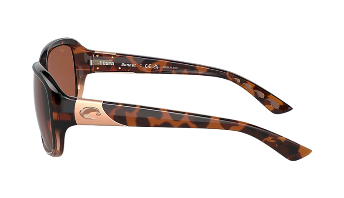 Sunglasses with tortoiseshell frame and brown lenses on a white background