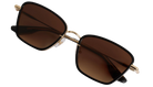 Gold-framed KREWE BELLA sunglasses with brown lenses on a white background