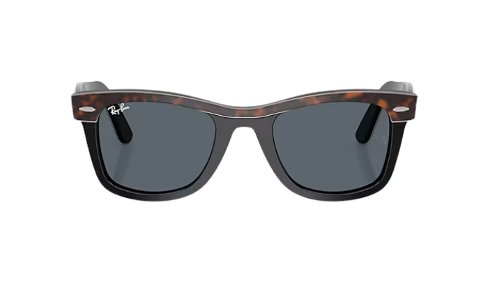 Sunglasses with tortoiseshell frame and dark lenses on a white background