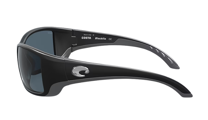 Black Costa wraparound sunglasses with gray lenses and a visible Costa brand logo on a white background