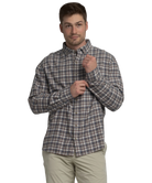 Man wearing a plaid shirt on a white background