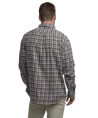 Man wearing a plaid shirt on a white background