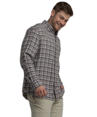 Man wearing a plaid shirt on a white background