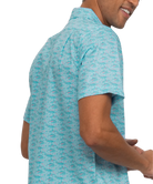 Man wearing a light blue patterned shirt on a white background