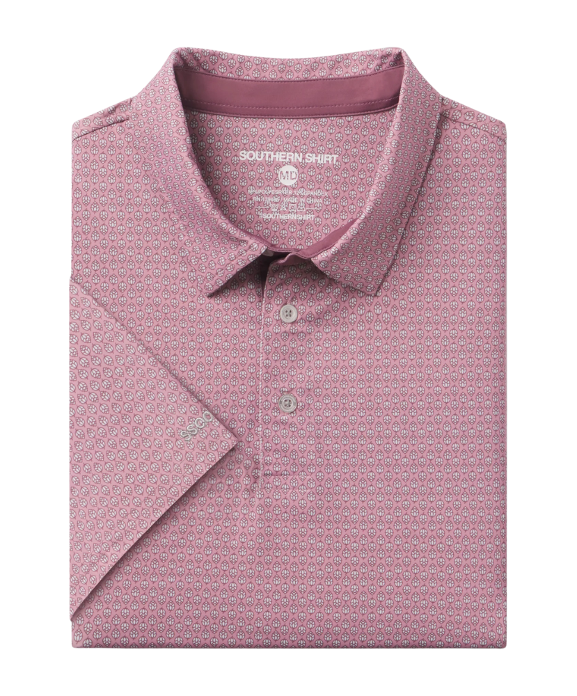 Folded pink polo shirt with a subtle pattern on a white background