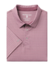 Folded pink polo shirt with a subtle pattern on a white background
