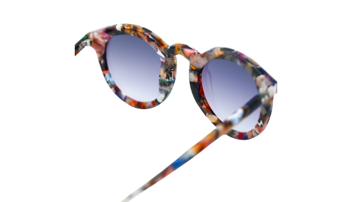Krewe Sunglasses with a multicolored frame and purple gradient lenses on a white background