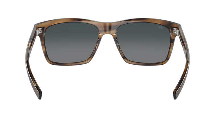 Costa Sunglasses with tortoise brown frame and gray lenses on a white background