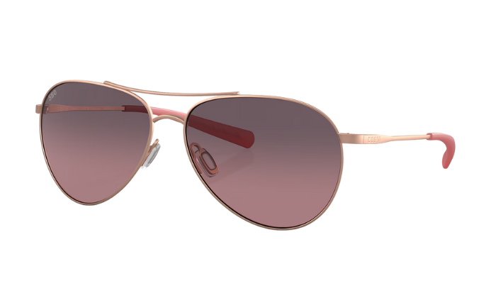 Costa Aviator sunglasses with satin rose gold frame and rose gradient lenses on a white background