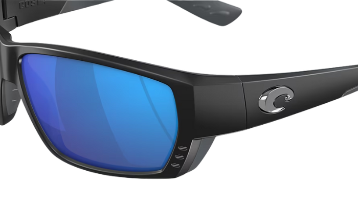 Black Costa wraparound sunglasses with blue lenses on a white background