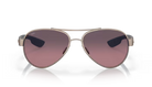 Aviator Costa sunglasses with a gradient pink lens on a white background