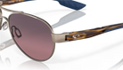 Aviator Costa sunglasses with a gradient pink lens on a white background