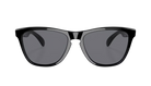 Black sunglasses with a thick, slightly glossy frame and dark gray lenses, shown from a front-facing perspective on a solid white background.