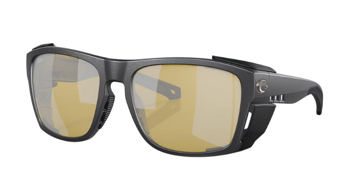 Sunglasses with gold-tinted lenses on a white background