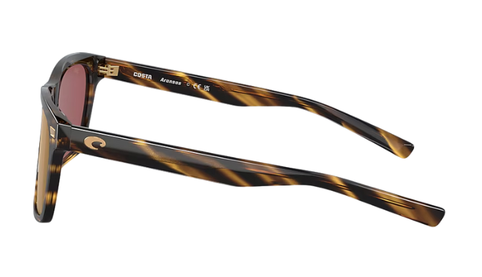 Costa Sunglasses with tortoise brown frame and gold mirror lenses on a white background