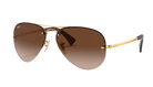 RayBan Aviator sunglasses with gold frame and brown gradient lenses on a white background