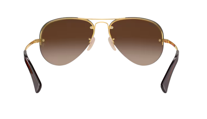 RayBan Aviator sunglasses with gold frame and brown gradient lenses on a white background