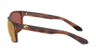 Costa sunglasses with a tortoiseshell frame and polarized gold mirror on a white background