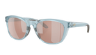 Costa Sunglasses with light blue frames and polarized copper lenses on a white background