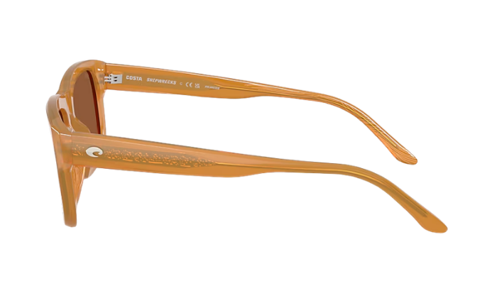 Pair of sunglasses with a beige frame on a white background