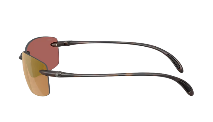 Costa Sunglasses with gold polarized lenses and tortoise frame on a white background