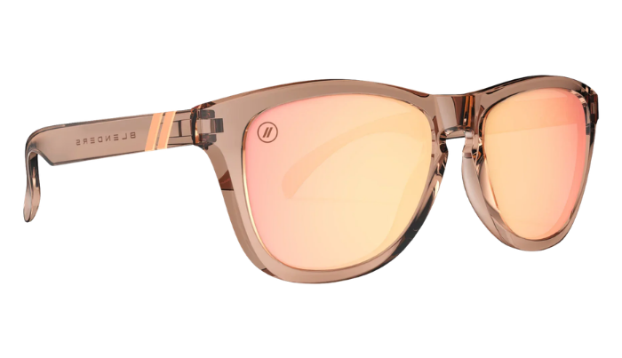 Blenders Sunglasses with rose gold frame and pink-tinted lenses on a white background