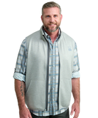 Man wearing a light gray vest WITH ZIPPER over a plaid shirt on a white background HUK GEAR